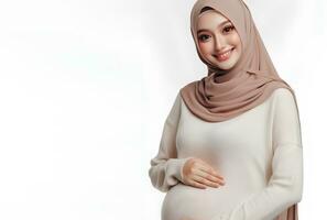 AI generated Asian woman in hijab with pose holding pregnant belly and smiling facial expression isolated white background photo