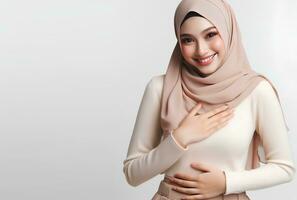 AI generated asian muslim woman in hijab with hands posing isolated white background photo