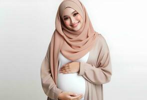 AI generated Asian woman in hijab with pose holding pregnant belly and smiling facial expression isolated white background photo