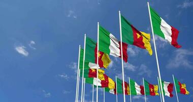 Cameroon and Italy Flags Waving Together in the Sky, Seamless Loop in Wind, Space on Left Side for Design or Information, 3D Rendering video