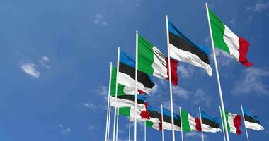 Estonia and Italy Flags Waving Together in the Sky, Seamless Loop in Wind, Space on Left Side for Design or Information, 3D Rendering video