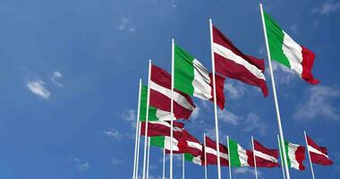 Latvia and Italy Flags Waving Together in the Sky, Seamless Loop in Wind, Space on Left Side for Design or Information, 3D Rendering video