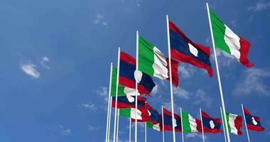 Laos and Italy Flags Waving Together in the Sky, Seamless Loop in Wind, Space on Left Side for Design or Information, 3D Rendering video