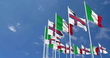 Faroe Islands and Italy Flags Waving Together in the Sky, Seamless Loop in Wind, Space on Left Side for Design or Information, 3D Rendering video