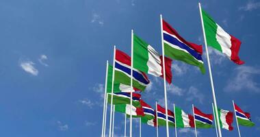 Gambia and Italy Flags Waving Together in the Sky, Seamless Loop in Wind, Space on Left Side for Design or Information, 3D Rendering video