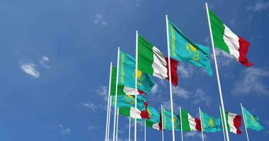 Kazakhstan and Italy Flags Waving Together in the Sky, Seamless Loop in Wind, Space on Left Side for Design or Information, 3D Rendering video