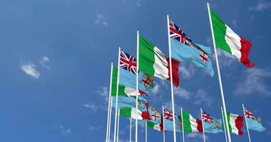 Fiji and Italy Flags Waving Together in the Sky, Seamless Loop in Wind, Space on Left Side for Design or Information, 3D Rendering video