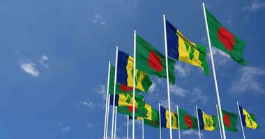 Saint Vincent and the Grenadines and Bangladesh Flags Waving Together in the Sky, Seamless Loop in Wind, Space on Left Side for Design or Information, 3D Rendering video