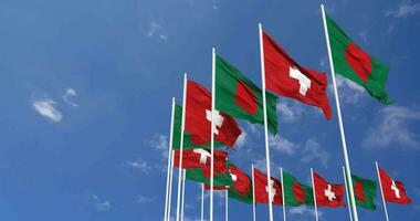 Switzerland and Bangladesh Flags Waving Together in the Sky, Seamless Loop in Wind, Space on Left Side for Design or Information, 3D Rendering video