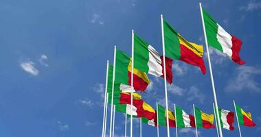 Benin and Italy Flags Waving Together in the Sky, Seamless Loop in Wind, Space on Left Side for Design or Information, 3D Rendering video