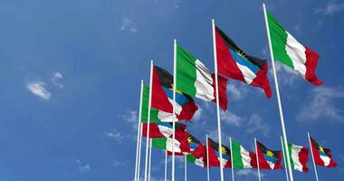 Antigua and Barbuda and Italy Flags Waving Together in the Sky, Seamless Loop in Wind, Space on Left Side for Design or Information, 3D Rendering video