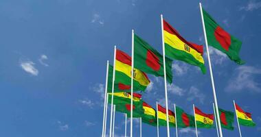 Bolivia and Bangladesh Flags Waving Together in the Sky, Seamless Loop in Wind, Space on Left Side for Design or Information, 3D Rendering video