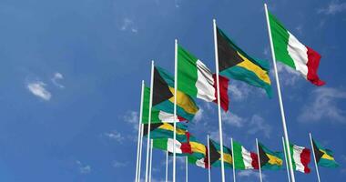 Bahamas and Italy Flags Waving Together in the Sky, Seamless Loop in Wind, Space on Left Side for Design or Information, 3D Rendering video