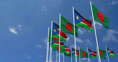 South Sudan and Bangladesh Flags Waving Together in the Sky, Seamless Loop in Wind, Space on Left Side for Design or Information, 3D Rendering video