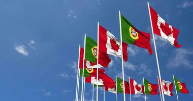 Portugal and Canada Flags Waving Together in the Sky, Seamless Loop in Wind, Space on Left Side for Design or Information, 3D Rendering video