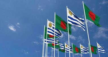 Uruguay and Bangladesh Flags Waving Together in the Sky, Seamless Loop in Wind, Space on Left Side for Design or Information, 3D Rendering video