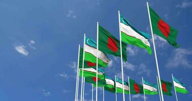 Uzbekistan and Bangladesh Flags Waving Together in the Sky, Seamless Loop in Wind, Space on Left Side for Design or Information, 3D Rendering video