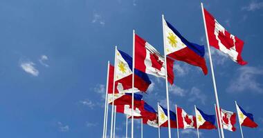 Philippines and Canada Flags Waving Together in the Sky, Seamless Loop in Wind, Space on Left Side for Design or Information, 3D Rendering video