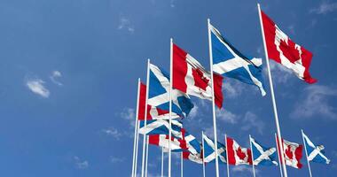 skottland och kanada flaggor vinka tillsammans i de himmel, sömlös slinga i vind, Plats på vänster sida för design eller information, 3d tolkning video