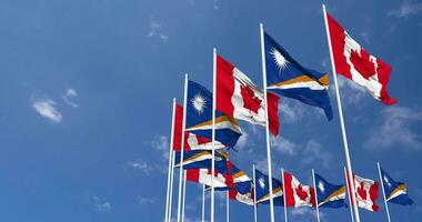Marshall Islands and Canada Flags Waving Together in the Sky, Seamless Loop in Wind, Space on Left Side for Design or Information, 3D Rendering video