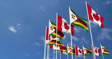 Zimbabwe and Canada Flags Waving Together in the Sky, Seamless Loop in Wind, Space on Left Side for Design or Information, 3D Rendering video