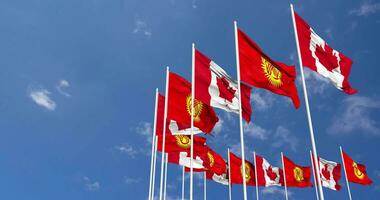 Kyrgyzstan and Canada Flags Waving Together in the Sky, Seamless Loop in Wind, Space on Left Side for Design or Information, 3D Rendering video