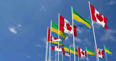 Gabon and Canada Flags Waving Together in the Sky, Seamless Loop in Wind, Space on Left Side for Design or Information, 3D Rendering video