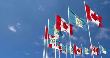 Guatemala and Canada Flags Waving Together in the Sky, Seamless Loop in Wind, Space on Left Side for Design or Information, 3D Rendering video