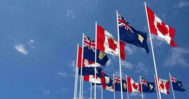 Anguilla and Canada Flags Waving Together in the Sky, Seamless Loop in Wind, Space on Left Side for Design or Information, 3D Rendering video