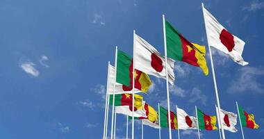 Cameroon and Japan Flags Waving Together in the Sky, Seamless Loop in Wind, Space on Left Side for Design or Information, 3D Rendering video