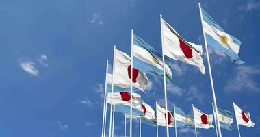 Argentina and Japan Flags Waving Together in the Sky, Seamless Loop in Wind, Space on Left Side for Design or Information, 3D Rendering video