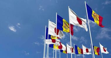 Andorra and Japan Flags Waving Together in the Sky, Seamless Loop in Wind, Space on Left Side for Design or Information, 3D Rendering video