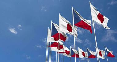 Czech Republic and Japan Flags Waving Together in the Sky, Seamless Loop in Wind, Space on Left Side for Design or Information, 3D Rendering video