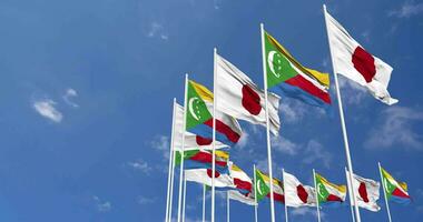 Comoros and Japan Flags Waving Together in the Sky, Seamless Loop in Wind, Space on Left Side for Design or Information, 3D Rendering video