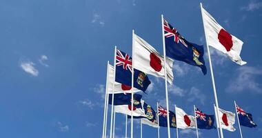Cayman Islands and Japan Flags Waving Together in the Sky, Seamless Loop in Wind, Space on Left Side for Design or Information, 3D Rendering video