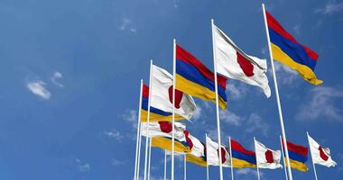Armenia and Japan Flags Waving Together in the Sky, Seamless Loop in Wind, Space on Left Side for Design or Information, 3D Rendering video