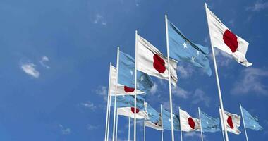 Federated States of Micronesia and Japan Flags Waving Together in the Sky, Seamless Loop in Wind, Space on Left Side for Design or Information, 3D Rendering video