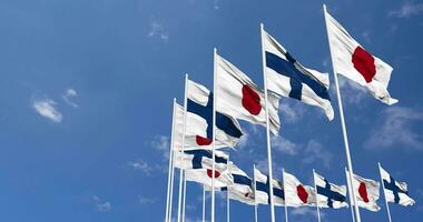 Finland and Japan Flags Waving Together in the Sky, Seamless Loop in Wind, Space on Left Side for Design or Information, 3D Rendering video