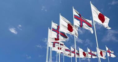 Faroe Islands and Japan Flags Waving Together in the Sky, Seamless Loop in Wind, Space on Left Side for Design or Information, 3D Rendering video