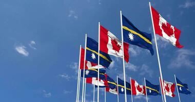 Nauru and Canada Flags Waving Together in the Sky, Seamless Loop in Wind, Space on Left Side for Design or Information, 3D Rendering video