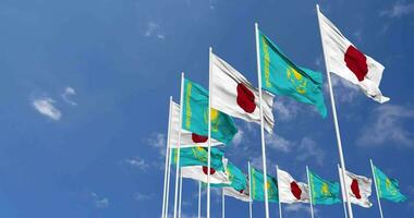 Kazakhstan and Japan Flags Waving Together in the Sky, Seamless Loop in Wind, Space on Left Side for Design or Information, 3D Rendering video