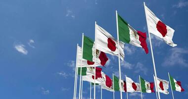 Mexico and Japan Flags Waving Together in the Sky, Seamless Loop in Wind, Space on Left Side for Design or Information, 3D Rendering video