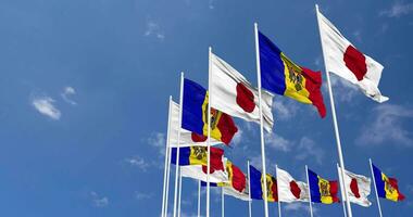 Moldova and Japan Flags Waving Together in the Sky, Seamless Loop in Wind, Space on Left Side for Design or Information, 3D Rendering video