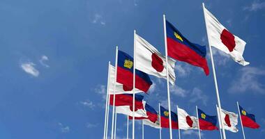 Liechtenstein and Japan Flags Waving Together in the Sky, Seamless Loop in Wind, Space on Left Side for Design or Information, 3D Rendering video