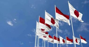 Monaco and Japan Flags Waving Together in the Sky, Seamless Loop in Wind, Space on Left Side for Design or Information, 3D Rendering video