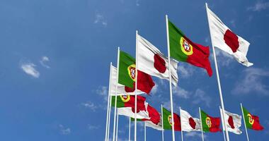 Portugal and Japan Flags Waving Together in the Sky, Seamless Loop in Wind, Space on Left Side for Design or Information, 3D Rendering video