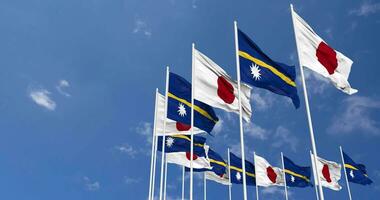 Nauru and Japan Flags Waving Together in the Sky, Seamless Loop in Wind, Space on Left Side for Design or Information, 3D Rendering video