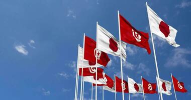 Tunisia and Japan Flags Waving Together in the Sky, Seamless Loop in Wind, Space on Left Side for Design or Information, 3D Rendering video