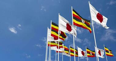 Uganda and Japan Flags Waving Together in the Sky, Seamless Loop in Wind, Space on Left Side for Design or Information, 3D Rendering video