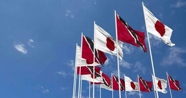 Trinidad and Tobago and Japan Flags Waving Together in the Sky, Seamless Loop in Wind, Space on Left Side for Design or Information, 3D Rendering video